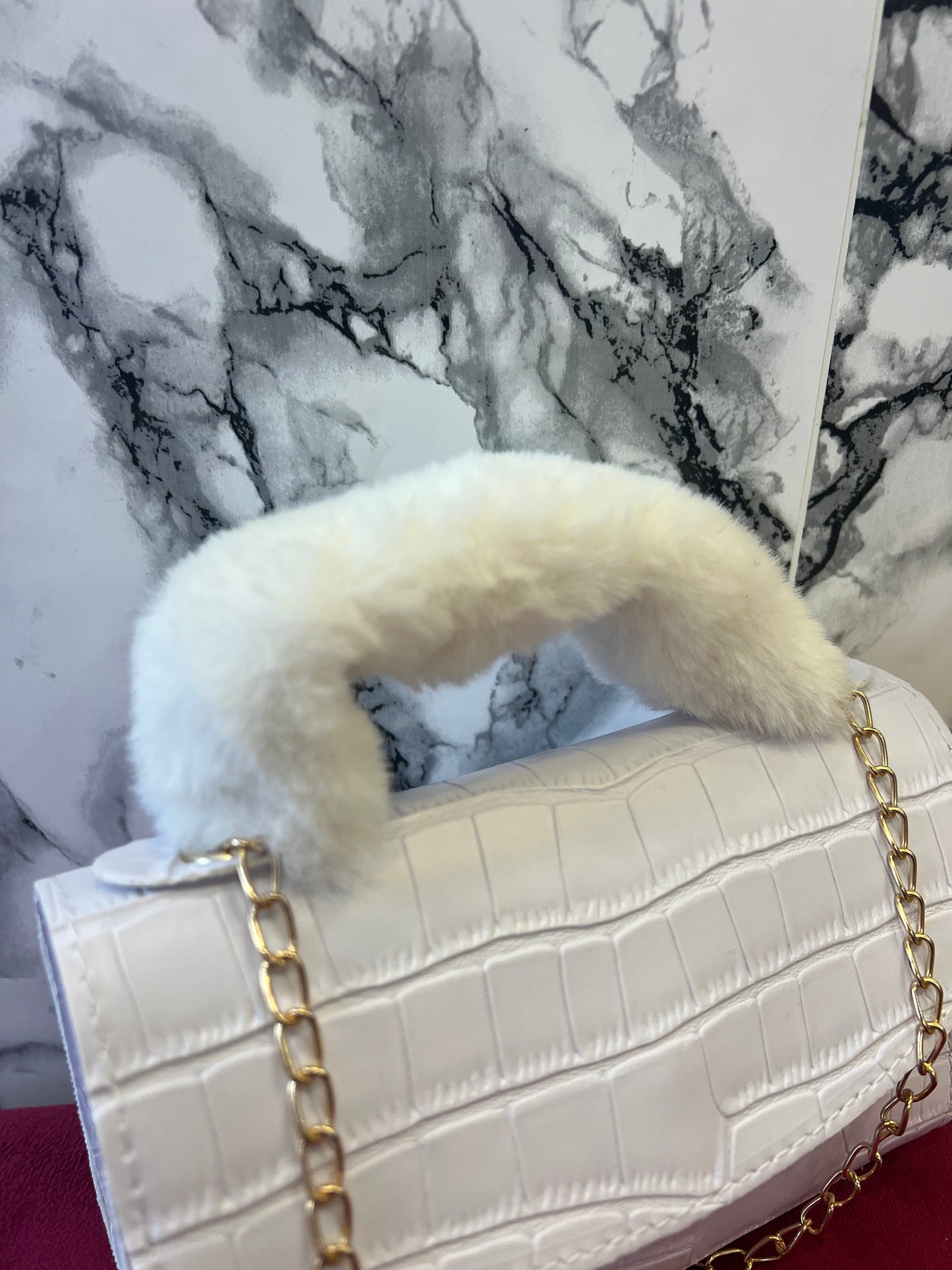 Borsa a mano con manicotto in pelliccia